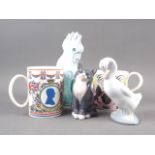 A Wedgwood 1953 commemorative mug, designed by Eric Ravilious, a Royal Copenhagen model of a cat,