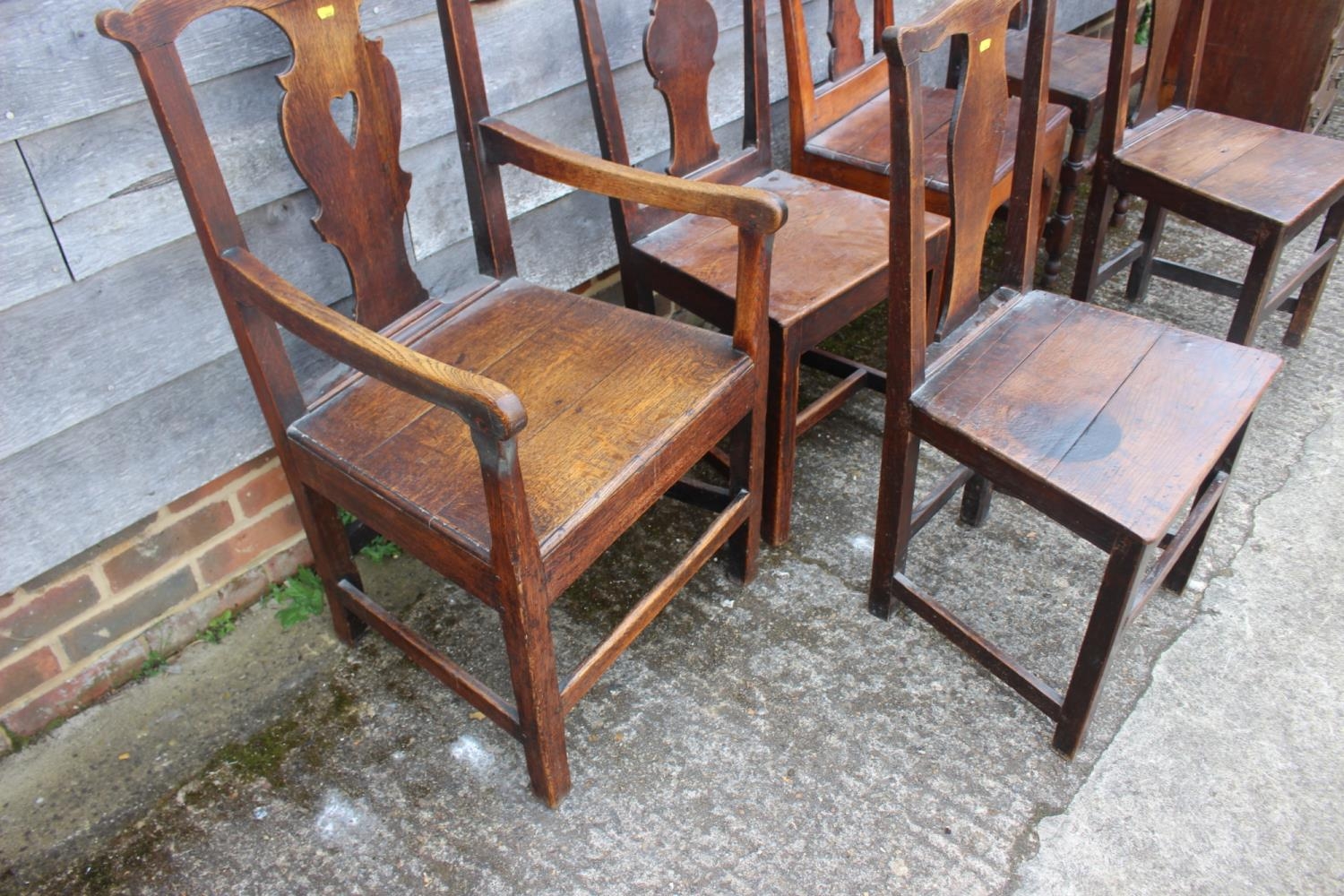 A Harlequin set of six 18th century oak dining chairs with panel seat, on stretchered supports (5+1) - Image 2 of 3