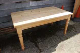 A pine scrub top table, on turned supports, 70" wide x 36" deep x 29 1/2" high