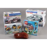 A Lego racer with pullback motor, a Lego football stadium 3403, two scale model racing car kits