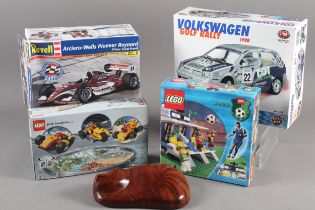 A Lego racer with pullback motor, a Lego football stadium 3403, two scale model racing car kits