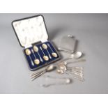 A silver hip flask, a set of six apostle spoons, in box, three coffee spoons and other silvery