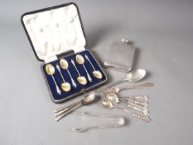 A silver hip flask, a set of six apostle spoons, in box, three coffee spoons and other silvery