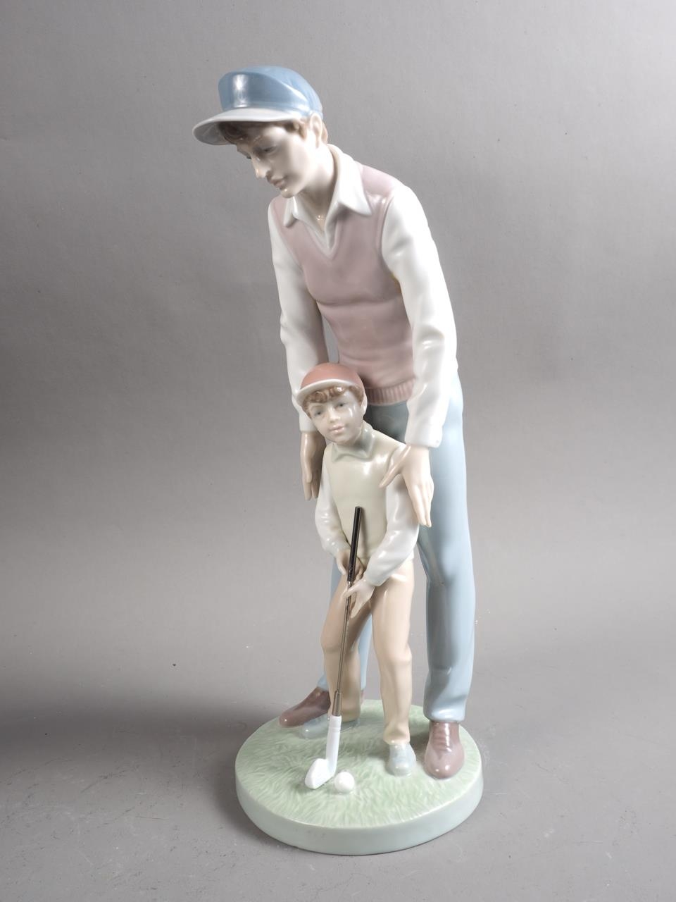 A Lladro figure of Don Quixote, 11 1/2" high, and a companion group, young golfer with father, 12" - Image 3 of 5