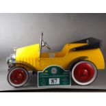 A Great Gizmos painted metal pedal car, in the vintage style, and a Bentley Drivers Club Rally sign