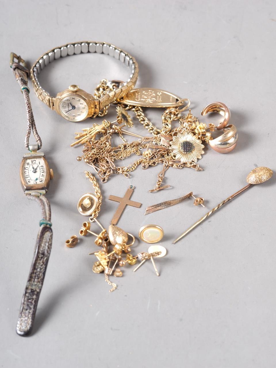 Two lady's 9ct gold cased wristwatches, a Victorian stick pin with yellow metal top, a 9ct gold "