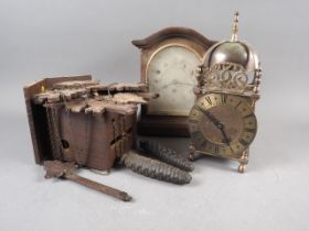 A Black Forest cuckoo clock, a well reproduced lantern clock with quartz movement and an oak cased