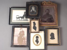Three 19th century carved paper silhouettes of gentlemen, a 19th century tin type portrait of an