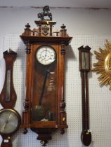 An early 20th century Vienna type wall clock with eight-day striking movement, in walnut case with