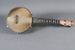 A Vintage Dulcetta four-string banjolele, 22" long