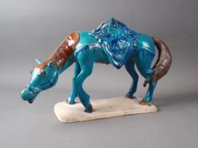 A "Tang" style horse with turquoise glazed body, 9 1/2" high