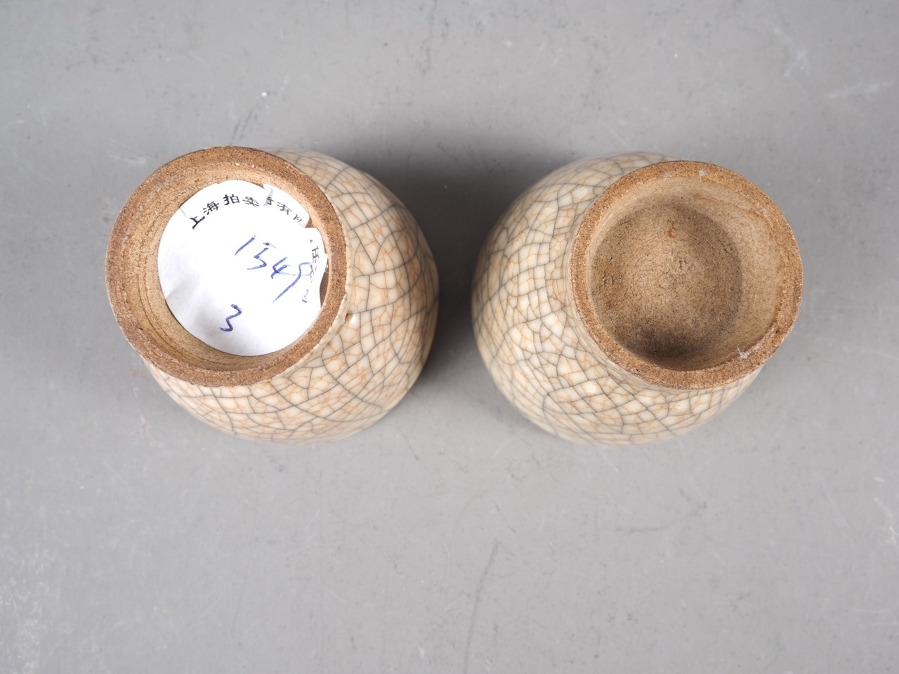 A pair of cream crackle glaze pottery tea bowls, 1 1/2" high - Image 3 of 3