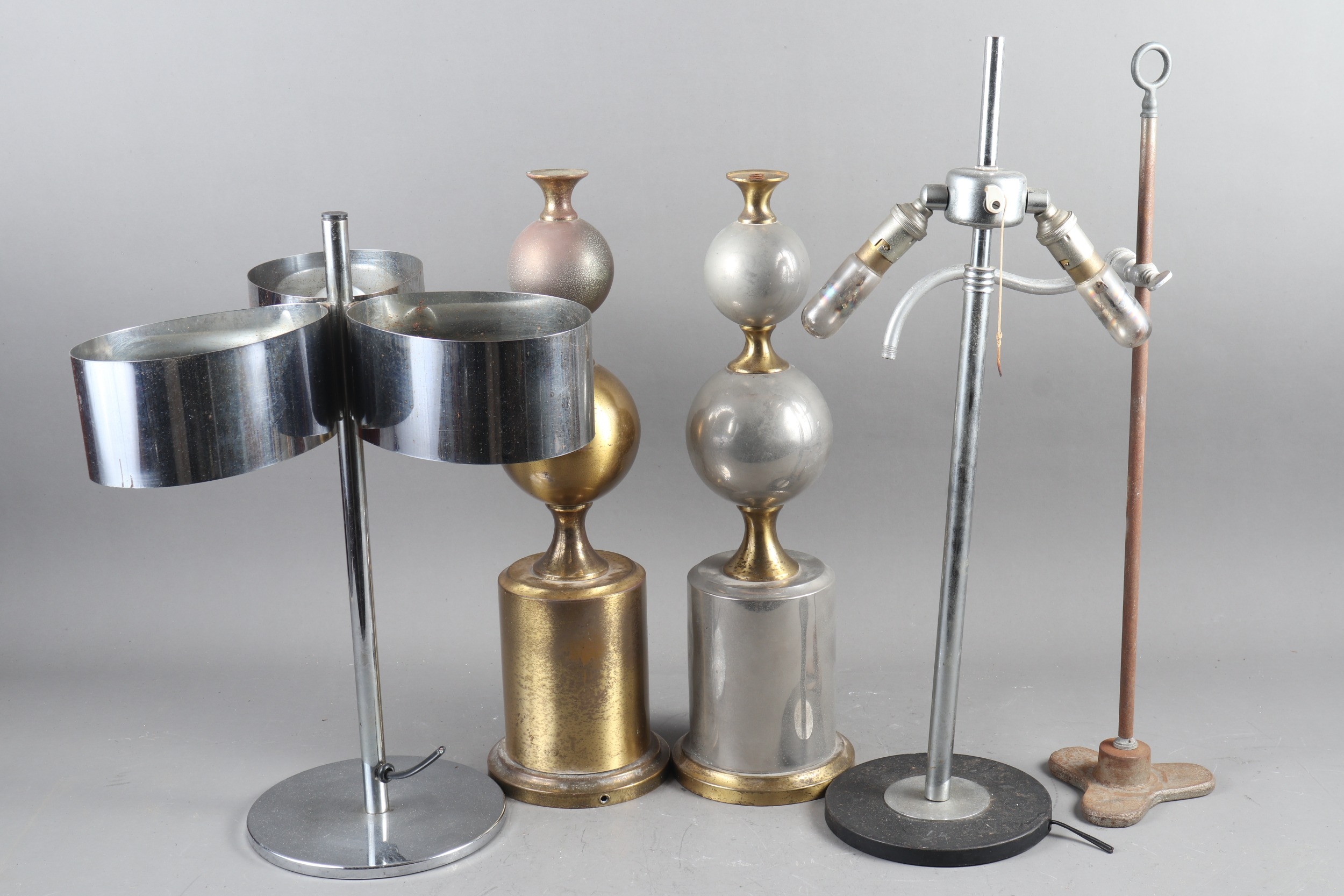 A matched pair of brass and steel bulbous table lamps, on cylindrical and circular bases, 16 3/4"