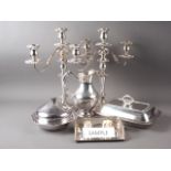 A pair of silver plated three-light table candelabra, a pair of single light candlesticks, a