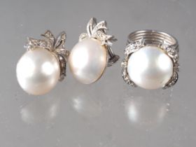 A pair of white metal, rose diamond and blister half pearl set ear clips and a matching dress rings,