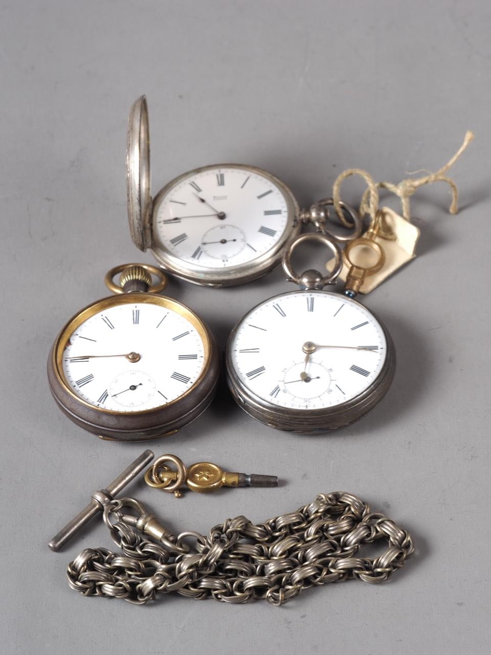 Two silver cased open faced pocket watches, a silver cased hunter pocket watch and a watch chain