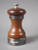 A mahogany and silver mounted "Peter Piper" pepper grinder, 4" high