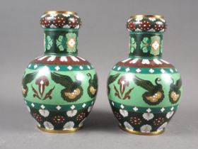 A pair of Japanese cloisonne bulbous vases with swan and flower decoration, 8" high (both damaged)