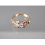 A Victorian yellow metal, opal and ruby dress ring, size L, 1.9g