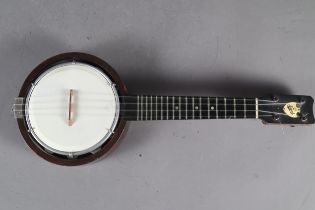 A Vintage Keech four-string banjolele, 21" long