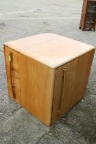 A 1930s walnut metamorphic cube desk, fitted three doors, concealed kneehole and three open corner