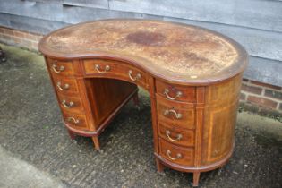 A Gillows style mahogany, satinwood banded and box line inlaid kidney-shape desk, fitted eight