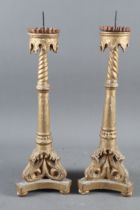 A pair of 19th century Venetian carved giltwood spiral stem and acanthus scroll trefoil base pricket