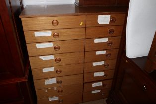 A 1960s Schreiber sapele nest of sixteen graduated drawers, 39 1/2" wide x 17 1/2" deep x 48 1/2"