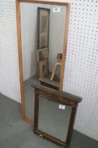 A rectangular oak framed slip wall mirror, 35 1/2" x 11 1/2", and a smaller gilt framed wall mirror,