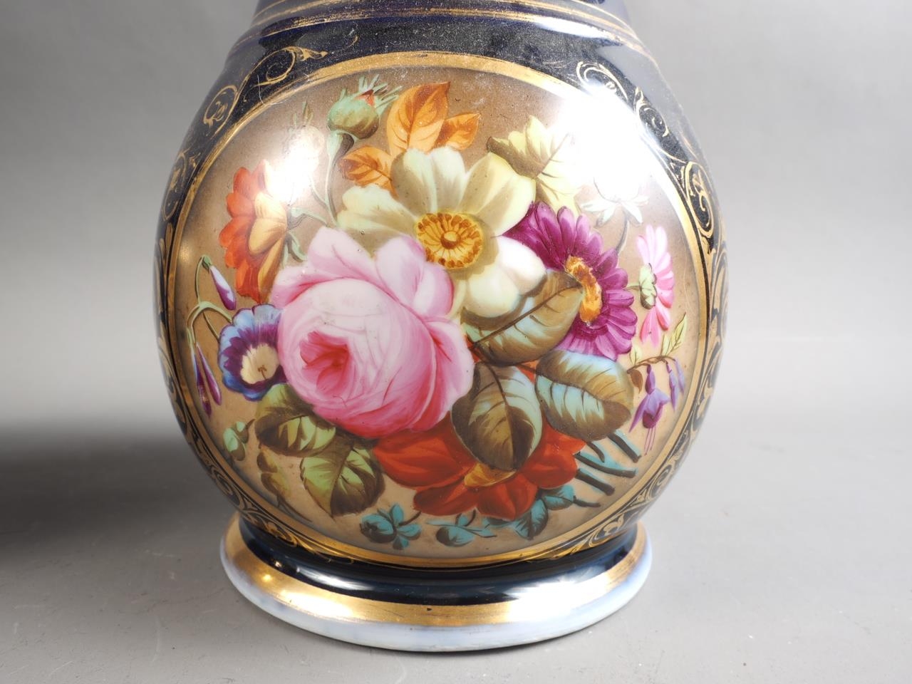 A pair of early 19th century bone china vases with flared rims and floral reserve panels on a blue - Image 3 of 16