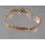 A 15ct gold four-bar gate bracelet, 12.4g