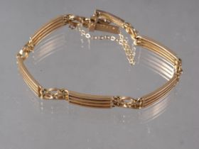 A 15ct gold four-bar gate bracelet, 12.4g