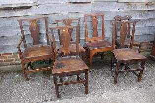 A Harlequin set of six 18th century oak dining chairs with panel seat, on stretchered supports (5+1)