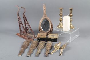 A set of four brass furniture mounts, two French gilt brass light switches, a pair of brass