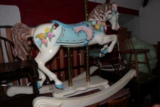 An American carved wood and painted galloper/rocking horse by S&S wood carvers, Santa Anna