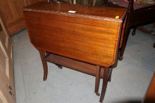 An Edwardian walnut and satinwood banded Sutherland tea table with pierced end supports, 24" wide