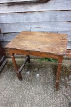 An 18th century oak side table with planked top, on turned and stretchered supports, 30 1/2" wide