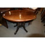 A 19th century walnut and inlaid tilt top occasional table, on quadruple turned splay supports,