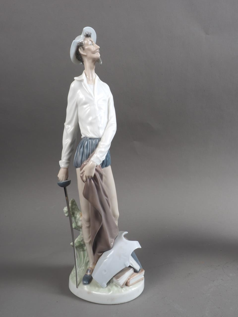 A Lladro figure of Don Quixote, 11 1/2" high, and a companion group, young golfer with father, 12" - Image 4 of 5