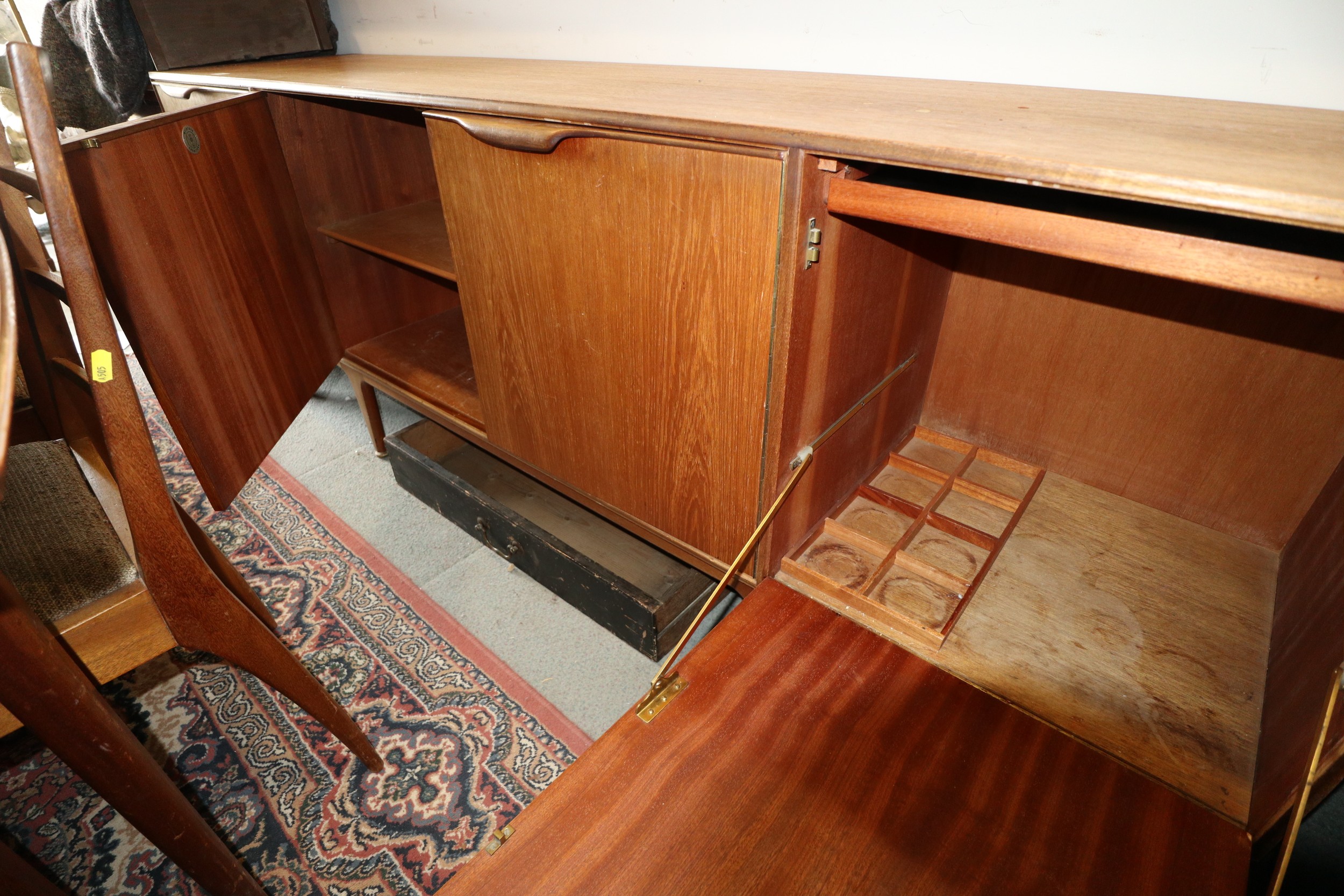 A 1960s McIntosh sideboard, fitted three drawers and three doors enclosed shelves, cellarette and - Image 3 of 6