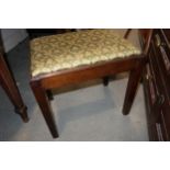 A 19th century mahogany rectangular frame stool with drop-in seat, on square taper supports, and