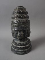 A Khmer patinated four-faced crowned Buddha head, 7 1/2" high