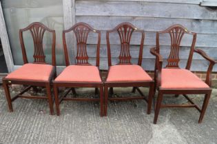 A set of four 19th century mahogany dining chairs with humpbacks and drop-in seats, on square