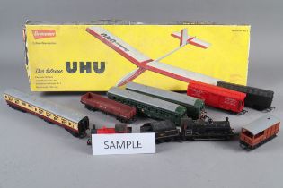 A Tri-ang railways locomotive and other rolling stock and accessories, the UHU balsa wood and