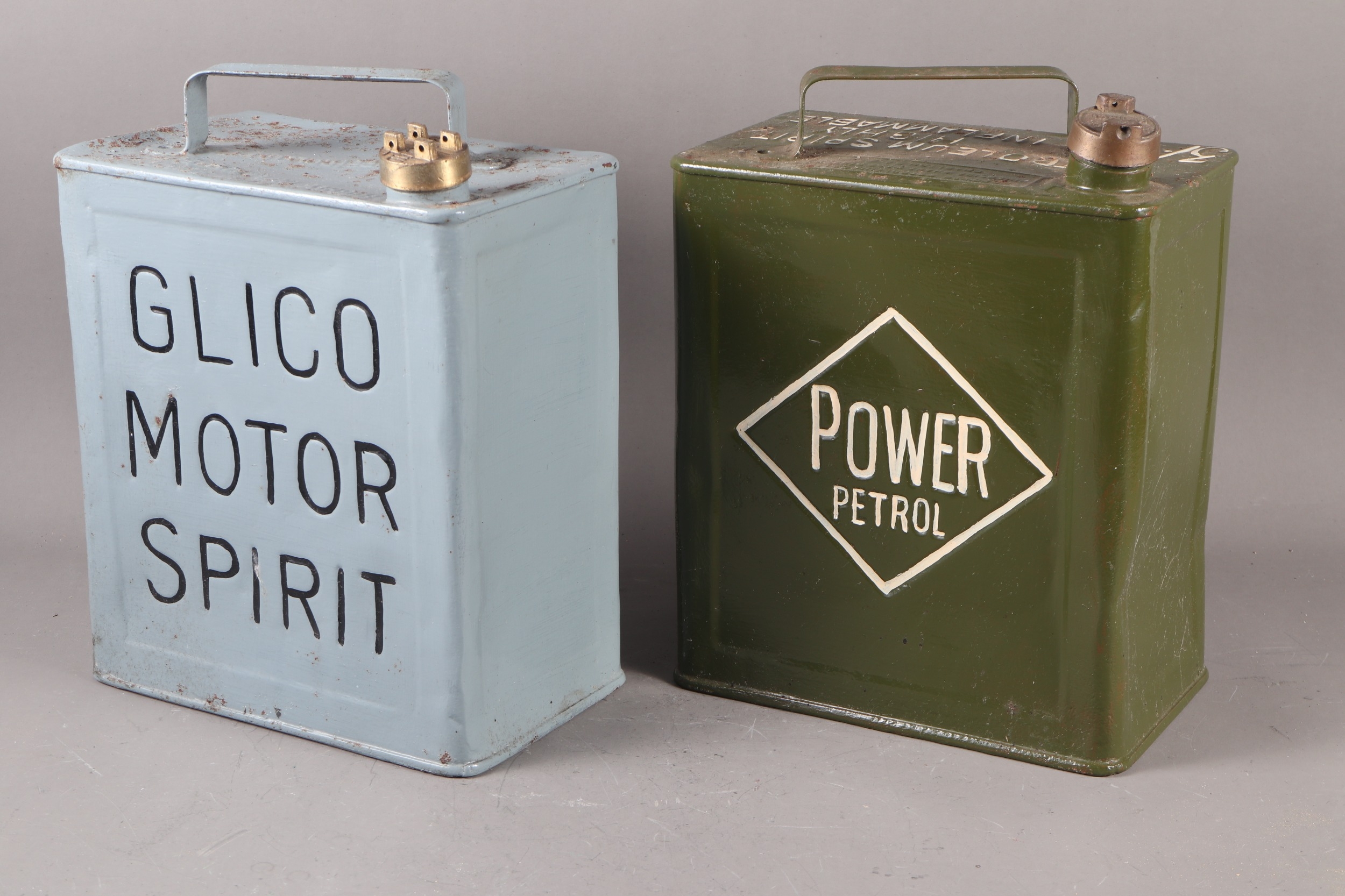 A vintage pale blue painted Glico Motor Spirit can, 12 1/2" high, and a green painted Power Petrol