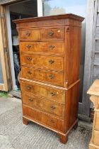 A walnut tallboy, fitted two drawers over three large graduated and three further graduated drawers,