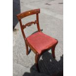 A 19th century mahogany bar back dining chair with drop-in seat, on sabre leg supports