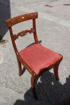 A 19th century mahogany bar back dining chair with drop-in seat, on sabre leg supports
