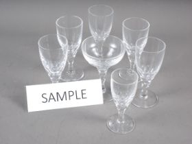 A set of seventeen port glasses with faceted stems and two matching glasses