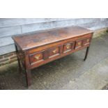 An 18th century fruitwood dresser base, fitted one short and two long fielded panel front drawers,